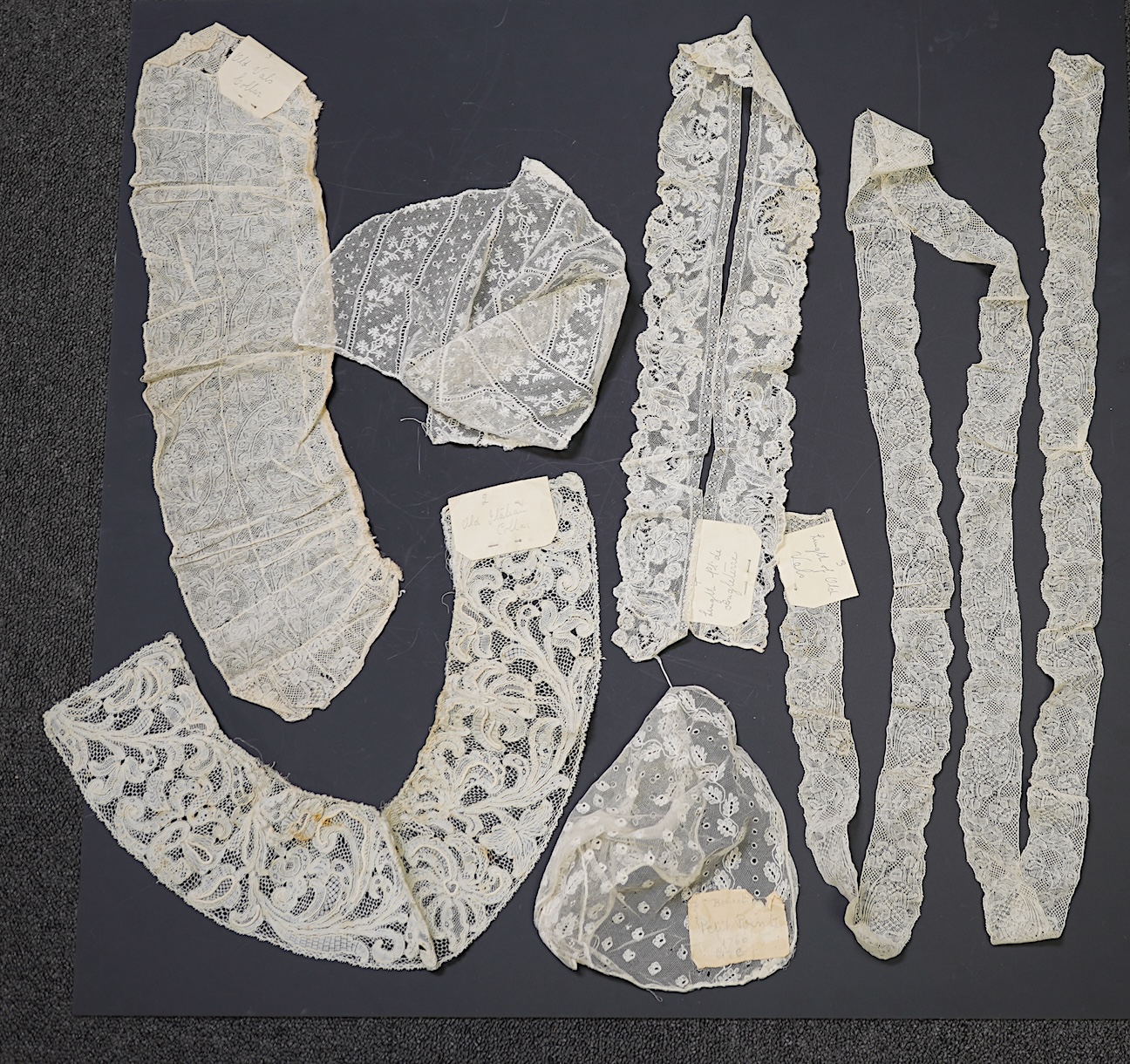 Various lengths of 18th and 19th century lace trimming and two needle run bonnets. Including a collar made from two rows of 18th century Valenciennes lace, a length Valenciennes lace, a shorter length of Pointe de Anglet